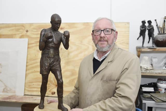 Sculptor Alan Herriot with the maquette of the statue in September.