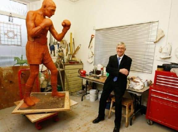 Ken Buchanan gets the first glimpse of his statue created by renowned Scottish sculptor Alan Herriot thanks to the efforts of the Ken Buchanan Foundation. It will be displayed in Leith. Picture: Paul Reid