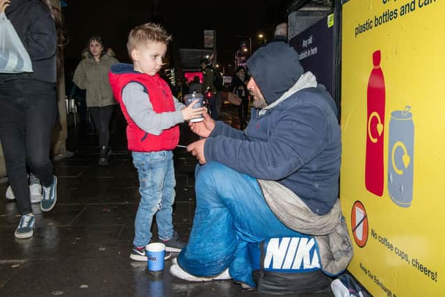 Richard Roncero and son Alfie, 6, volunteer to help the homeless charity Hands of Hope. Pic: Ian Georgeson.