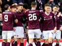 Hearts players celebrate Irving's goal.