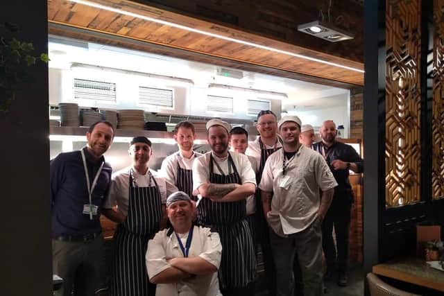 John Kelly and staff working at All Bar One in Edinburgh Airport    picture: Supplied