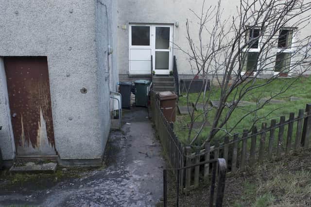 Kirkliston residents have been unable to use their front doors for seven days after a clogged drain led to a raw sewage puddle forming between their properties and the local play park.