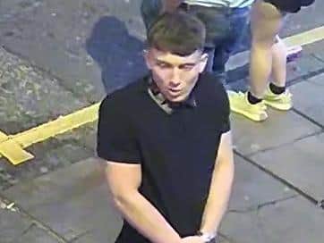 One of the men, pictured, is described as aged between 18 to 22, of slim build with short dark hair.