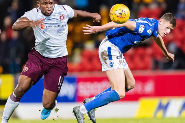 Uche Ikpeazu battles for possession during Hearts' last trip to McDiarmid Park. Picture: SNS