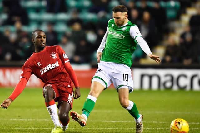 Glen Kamara and Martin Boyle in action during the last meeting between the sides in December. Picture: SNS