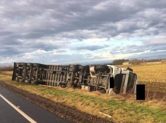 One of the overturned lorries