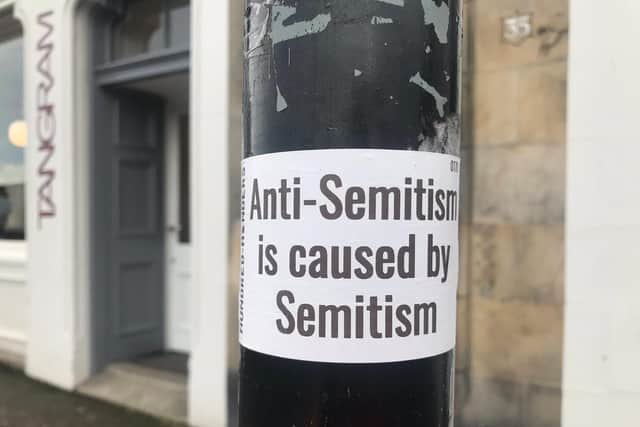 The stickers bear the name of white supremacist group Hundred Handers and tout a Neo-Nazi slogan. The stickers have been condemned by anti-racism groups. Picture: Submitted