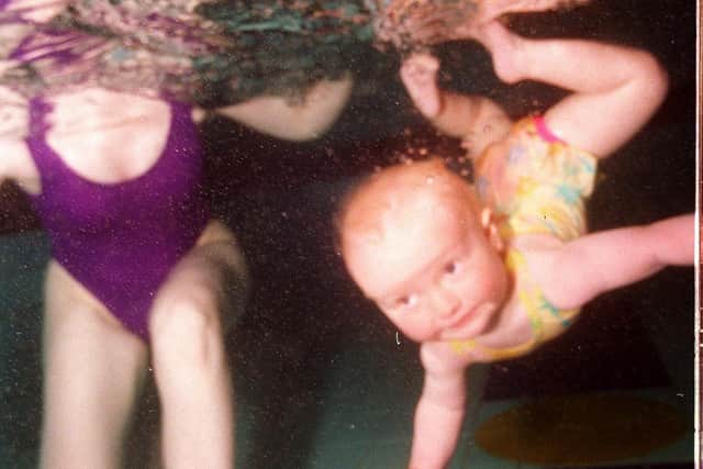 One-year-old Charlotte Clark swims in 1999.