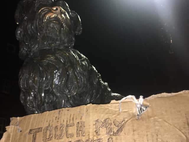 The famous Greyfriars Bobby on George IV Bridge was seen with a placard tied around its neck mockinglysaying: "Touch my nose, help spread COVID-19." picture: JPI Media