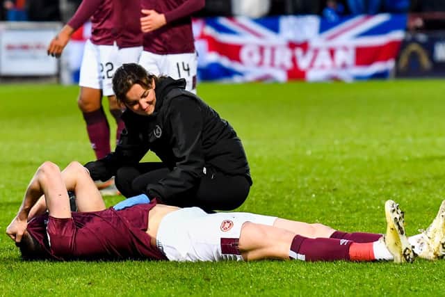John Souttar in pain on the turf after suffering an injury. Picture: SNS