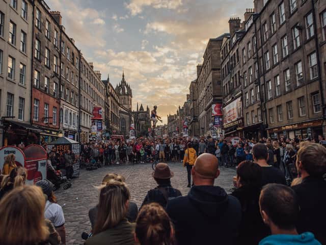 Tens of thousands of revellers crowd onto the Royal Mile every day during the Fringe for free street theatre performances.