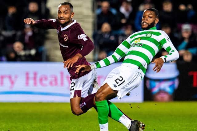 Hearts midfielder Loic Damour battles Olivier Ntcham during the last meeting between the sides. Picture: SNS