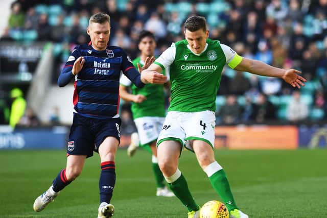Paul Hanlon in possession alongside Billy Mckay in the last meeting between the clubs at Easter Road. Picture: SNS