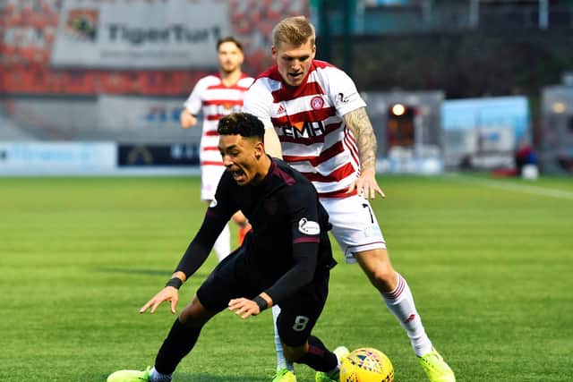 Sean Clare goes down under the attentions of Will Collar the last time Hearts faced Accies. Picture: SNS