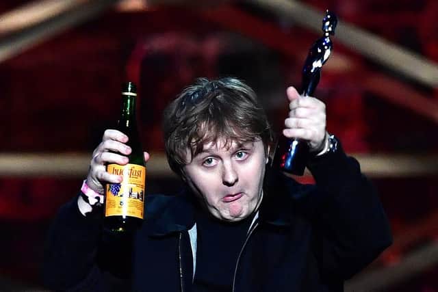 Lewis Capaldi accepts hte Song of the Year award with a bottle of Buckfast in hand. Picture: Gareth Cattermole / Getty Images
