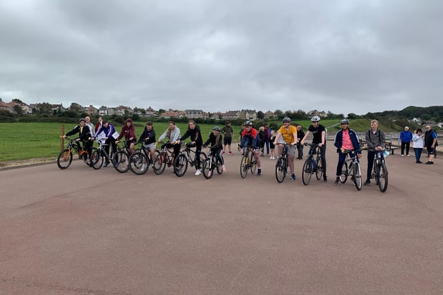Team Reece cycle ride along Morecambe promenade. The children are getting ready to set off along the promenade.