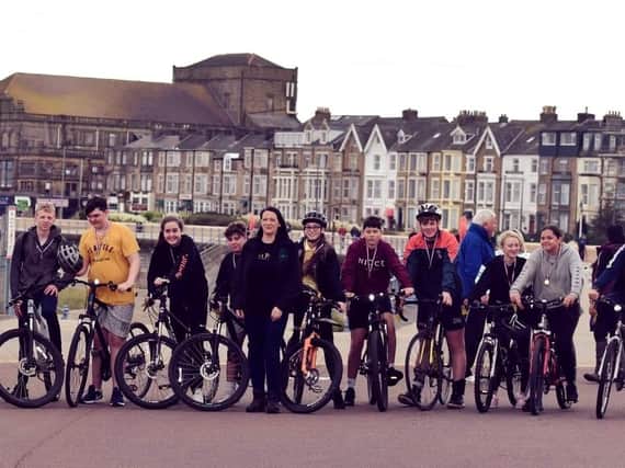 Team Reece cycle ride along Morecambe promenade. Pictured in the middle is Rachel O'Neil,  Reece Holt's mum,  with the schoolchildren who took part in the cycle ride.