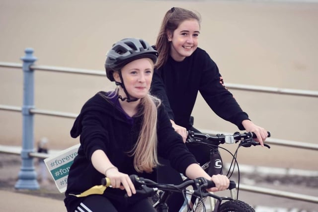 Team Reece cycle ride along Morecambe promenade. Pictured are Niamh and Suria.