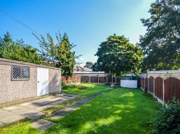 Outside There is a lawned garden to the front with gated access to the side leading to a driveway providing off street parking which in turn leads to a concrete sectional detached garage with up and over door. Larger than average lawned garden to the rear incorporating flagged patio and outbuilding which could be used for a variety of purposes.