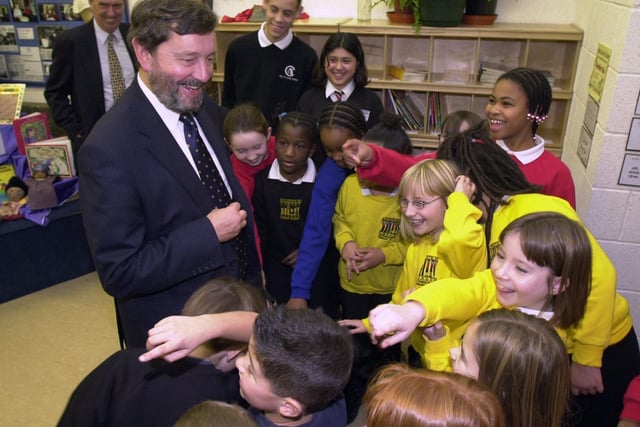 Secretary of State for Education and Employment David Blunkett talks to children during his visit to officially open Little London Community Primary School.