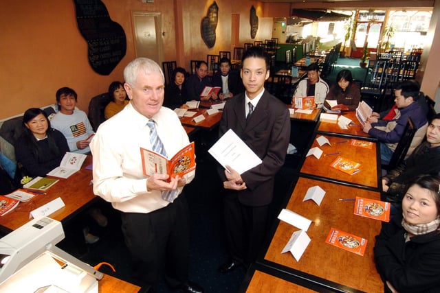 Tom Davy (L) with Rick Leung (R) interpreting from the Red Dragon restaurant, on Falsgrave Road, tutors a course on food hygiene specially for worker at Scarborough's Chinese restaurants.
