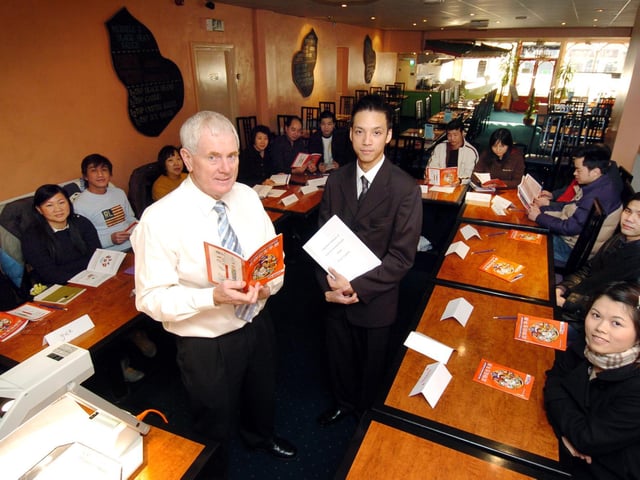 Tom Davy (L) with Rick Leung (R) interpreting from the Red Dragon restaurant, on Falsgrave Road, tutors a course on food hygiene specially for worker at Scarborough's Chinese restaurants.