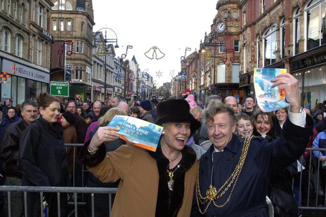 The Lord Mayor of Leeds Coun Bernard Atha and the Lady Mayoress Liz Dawn hand out tickets for the New Year's Eve party in the Millennium Square.