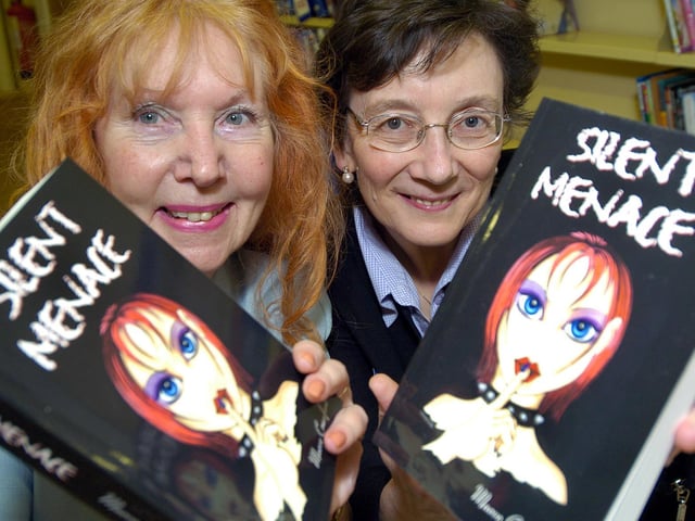 Maeve Crawford presents her book to Scarborough Librarys Principle Officer Sandra Turner.