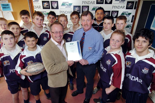 Scarborough Rugby Club sponsor Andrew Pindar (front centre left), with head coach Mike Holder, and youth development officer Junior Tupai (back) celebrate receiving the Sports Match Award, with rugby players from Scalby School.