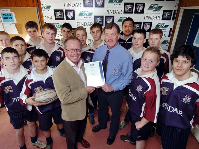 Scarborough Rugby Club sponsor Andrew Pindar (front centre left), with head coach Mike Holder, and youth development officer Junior Tupai (back) celebrate receiving the Sports Match Award, with rugby players from Scalby School.