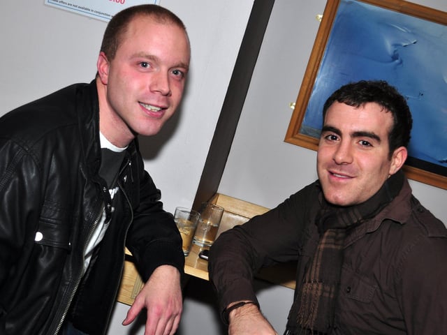 Oliver and Yousef grab a drink, in 2010.