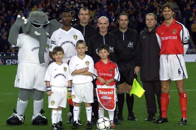 Captain's Lucas Radebe and Tony Adams pictured with referee Dermot Gallagher and his officials as well as mascots.