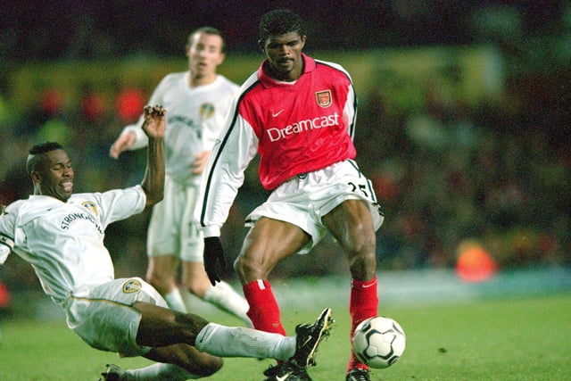 Nwankwo Kanu holds off Lucas Radebe. The first-half was very keenly contested and four Arsenal players - Henry, Keown, Lauren and Luzhny - went into Dermot Gallagher's book for fouls.