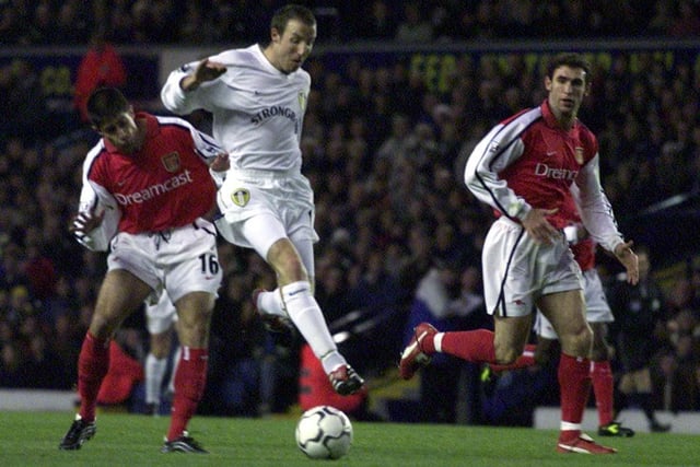 Lee Bowyer pushes forward despite the attention of Arsenal's Silvinho.