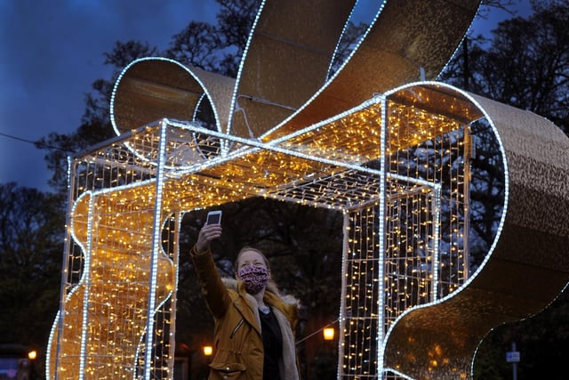 Clare Howes takes a selfie by the Chistmas present light installation.