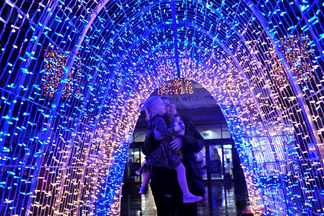Rachel Hodgson and her daughter 3 year old Violet in the light installation outside the Victoria Shopping Centre.
