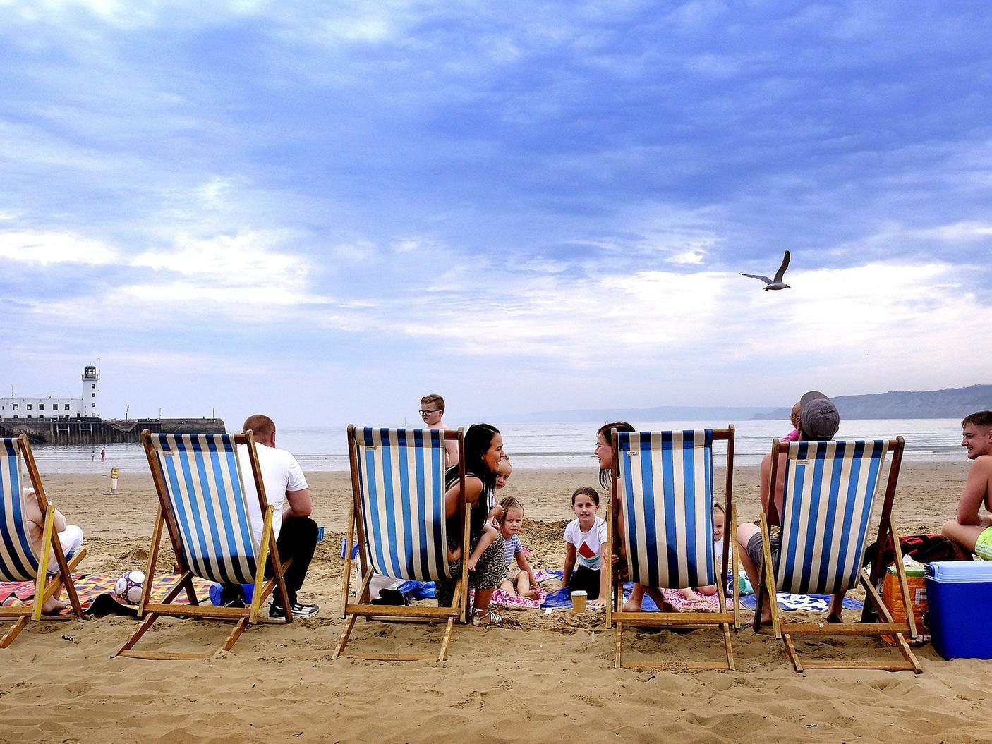 Families enjoy South Bay beach in the warm summer weather after lockdown.