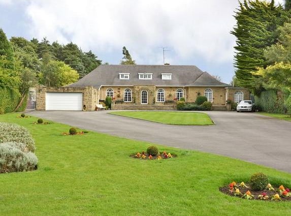 This seven bedroom home is in Harrogate Road in Alwoodley. The detached house sits in magnificent manicured grounds to both the front and rear, extending to approximately 1.2 acres