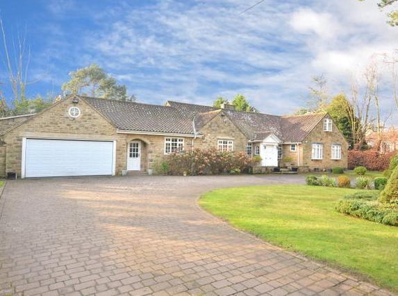 This four bedroomed home is in Manor House Lane in Alwoodley. The stone built detached bungalow has four bedrooms, three bathrooms and two reception rooms.