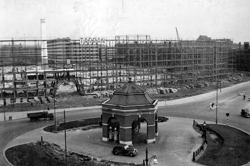 Eastgate roundabout with Appleyard petrol filling station in August 1938.  The large archway through to Oastler House is under construction.