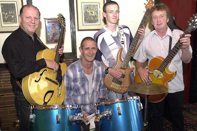 Musicians at the Burn Naze ready to celebrate the fifth anniversary of their weekly jam sessions in 2003. From left, Scott Oram, Ged Briggs, Kyle Briggs and Johhny McKenna.