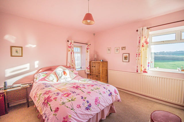 A double bedroom within Blackberry Cottage has a stunning outlook.