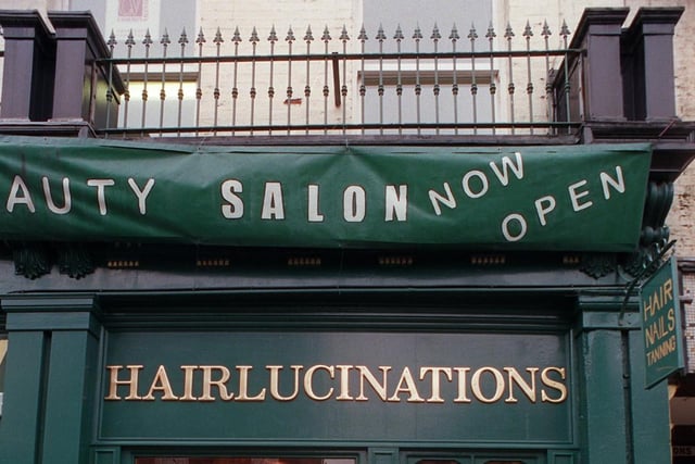 Hairlucinations on Church Street in the year 2000. Note the ornate balcony above the main shop window. This is another example of one of the fine buildings which can be found in the area