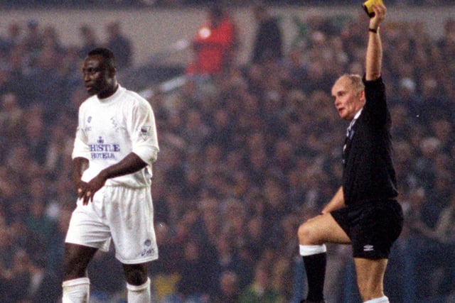 Tony Yeoboah is shown the yellow card by referee Keith Cooper during Leeds United's :League Cup fourth round clash against Blackburn Rovers at Elland Road in November 1995. He scored as Leeds won 2-1.