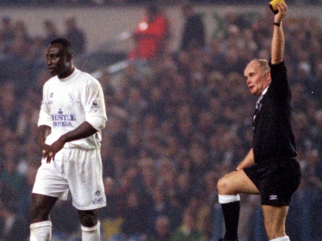 Tony Yeoboah is shown the yellow card by referee Keith Cooper during Leeds United's :League Cup fourth round clash against Blackburn Rovers at Elland Road in November 1995. He scored as Leeds won 2-1.