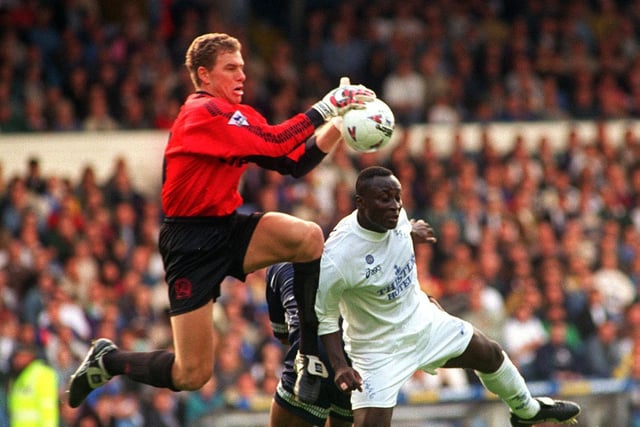 QPR goalkeeper Juergen Sommer takes the ball off the head Tony Yeboah during the Premier League clash at Elland Road in September 1995. Leeds lost 3-1.