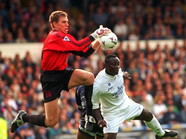 QPR goalkeeper Juergen Sommer takes the ball off the head Tony Yeboah during the Premier League clash at Elland Road in September 1995. Leeds lost 3-1.