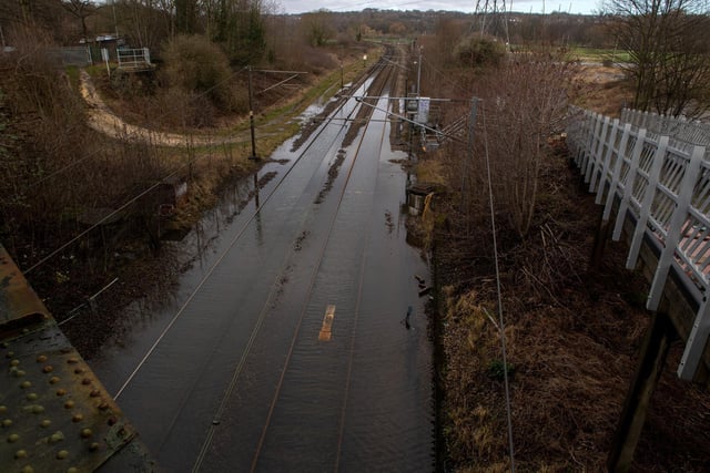 Raiway line flooding next to the River Aire at Kirkstall Bridge