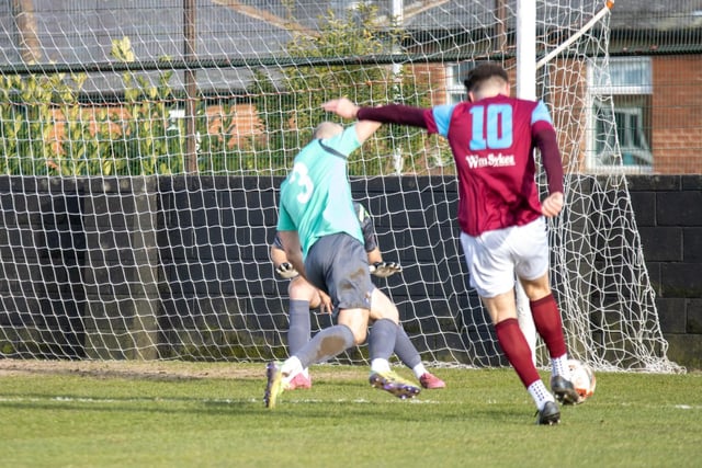 Joe Jagger takes the chance to shoot home the opening goal for Emley. Picture: Mark Parsons