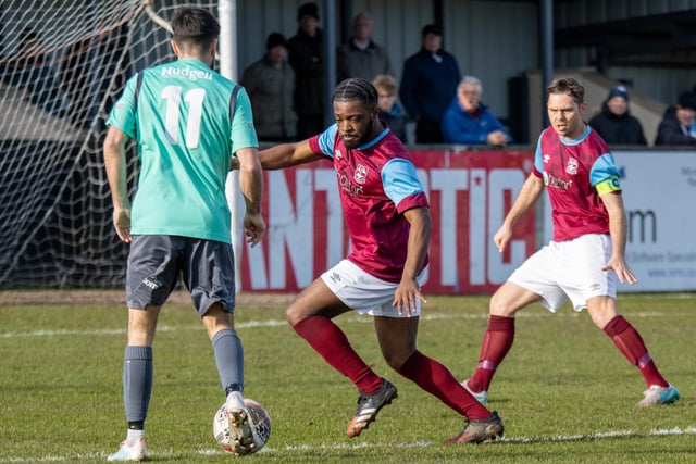 Emley full-back James Ngoe comes up against Barton Town's number 11, Curtis Bateson. Picture: Mark Parsons